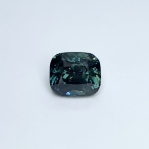 This 5.59 carat Teal Sapphire is well cut to bring out the best colour and luster