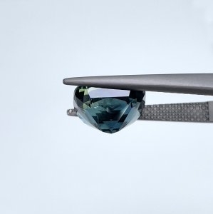This 5.59 carat Teal Sapphire is well cut to bring out the best colour and luster